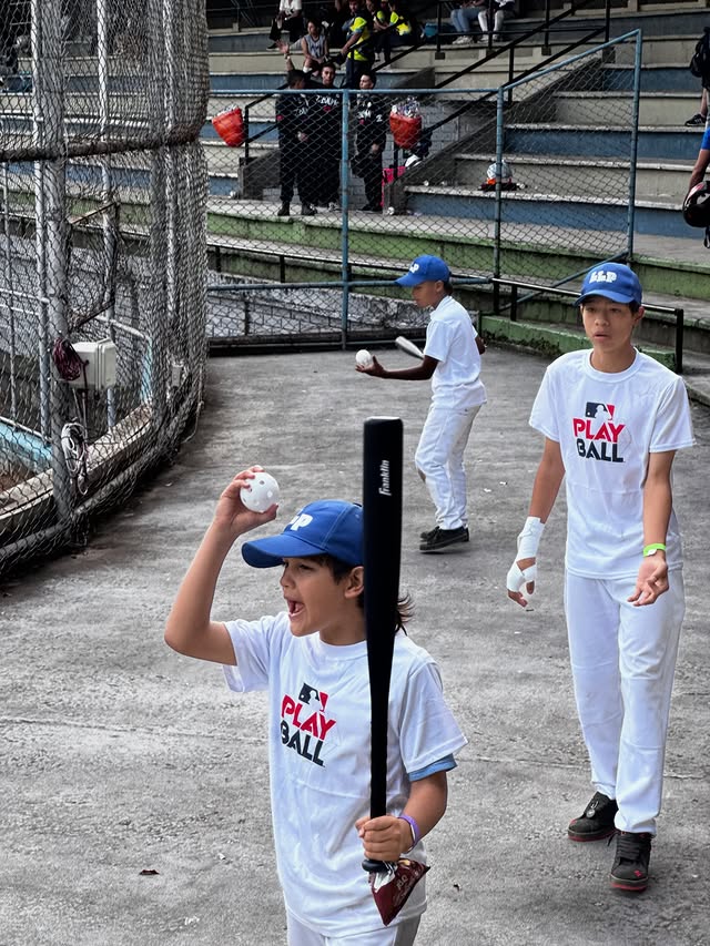 Kids practicing baseball